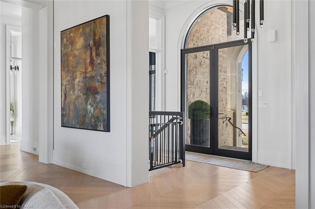 Foyer with french doors and parquet floors