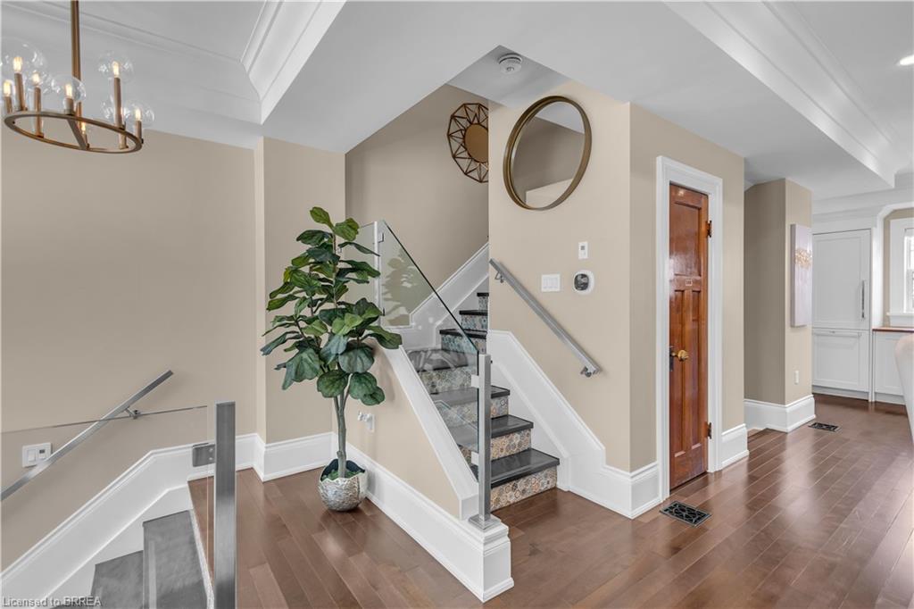 Hardwood flooring throughout the main floor, a beautiful architectural salvage door on the powder room.