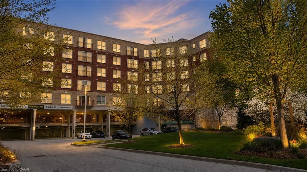 Multi-story residential building featuring a brick and stone facade