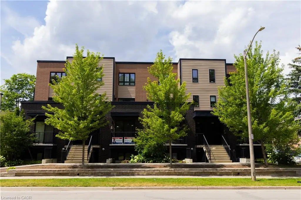 Contemporary multi-story facade featuring brick and horizontal siding
