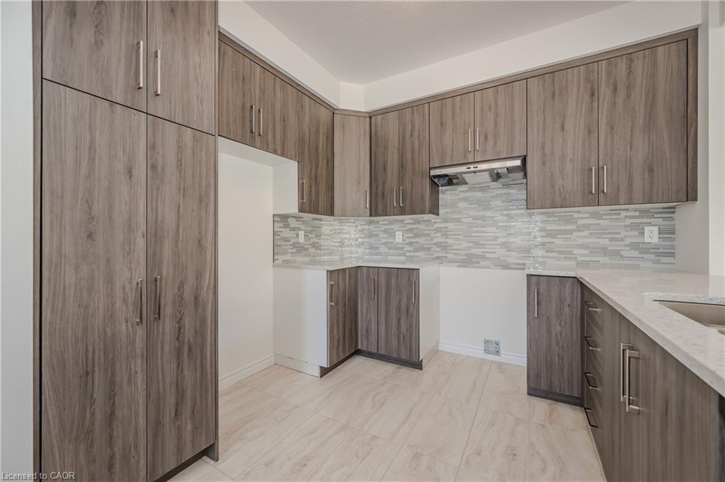 Stainless steel appliances are included in the kitchen