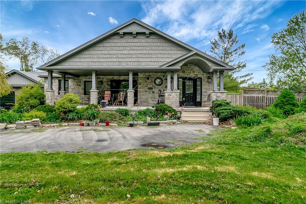 Craftsman-style house with covered porch and stone siding
