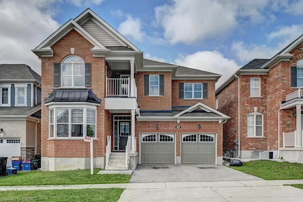 Brick exterior with a gabled roof and bay window