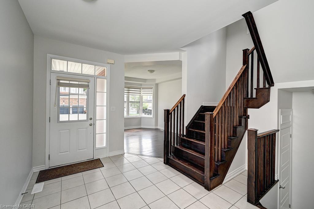 Entryway with white tile flooring