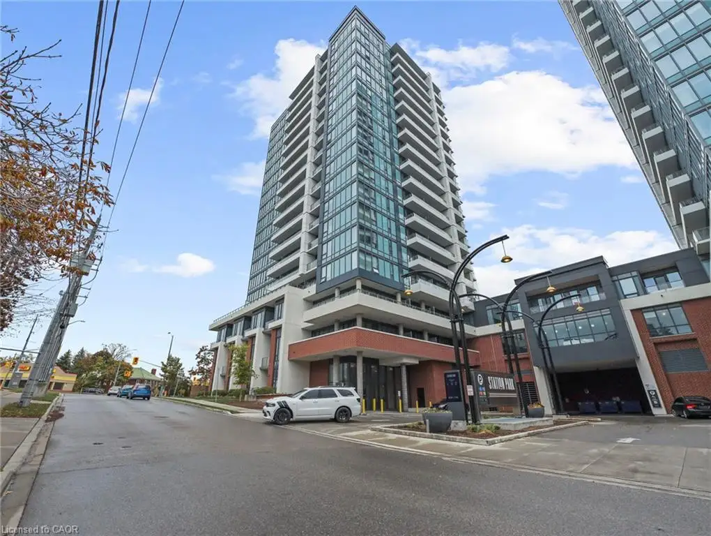 High-rise condominium building featuring a modern architectural design, extensive glass facade, and individual balconies
