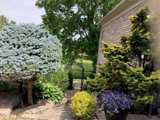 Landscaped exterior with private walkway down to lower exterior