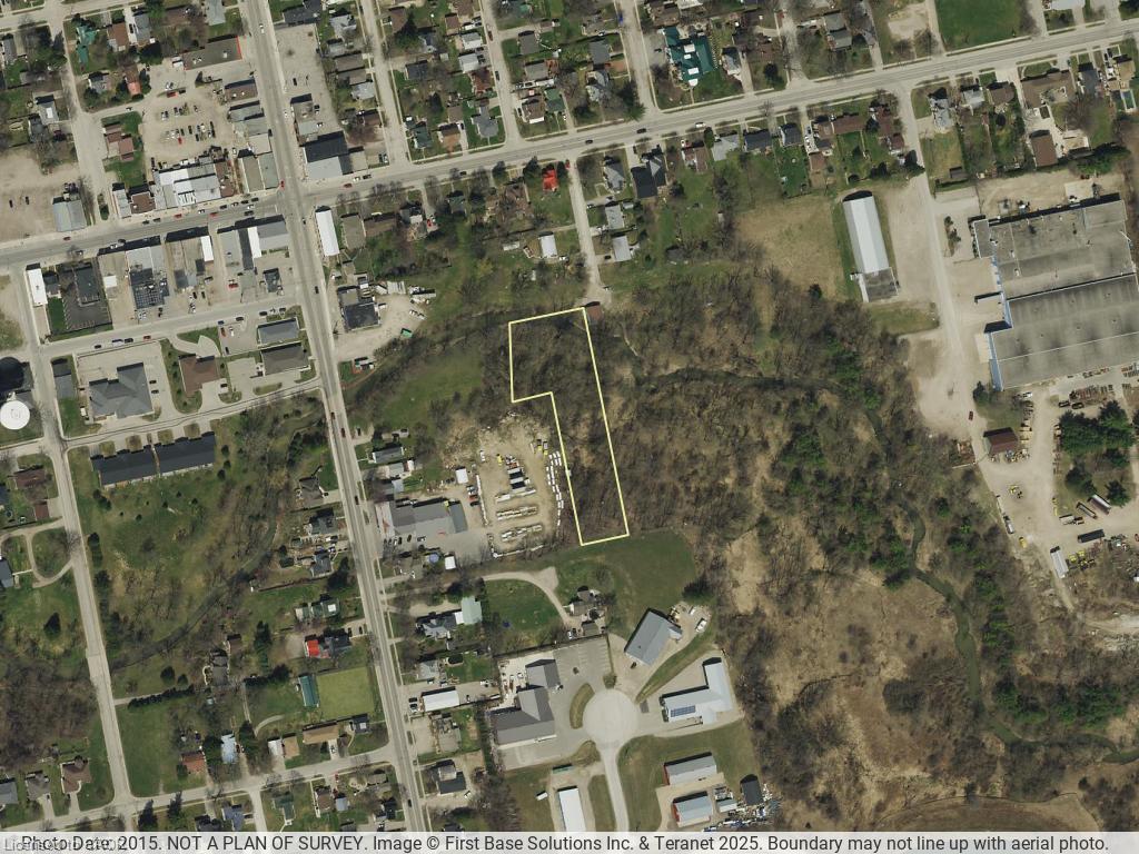 Aerial Photograph. Depicting the property boundary within a broader geographical context