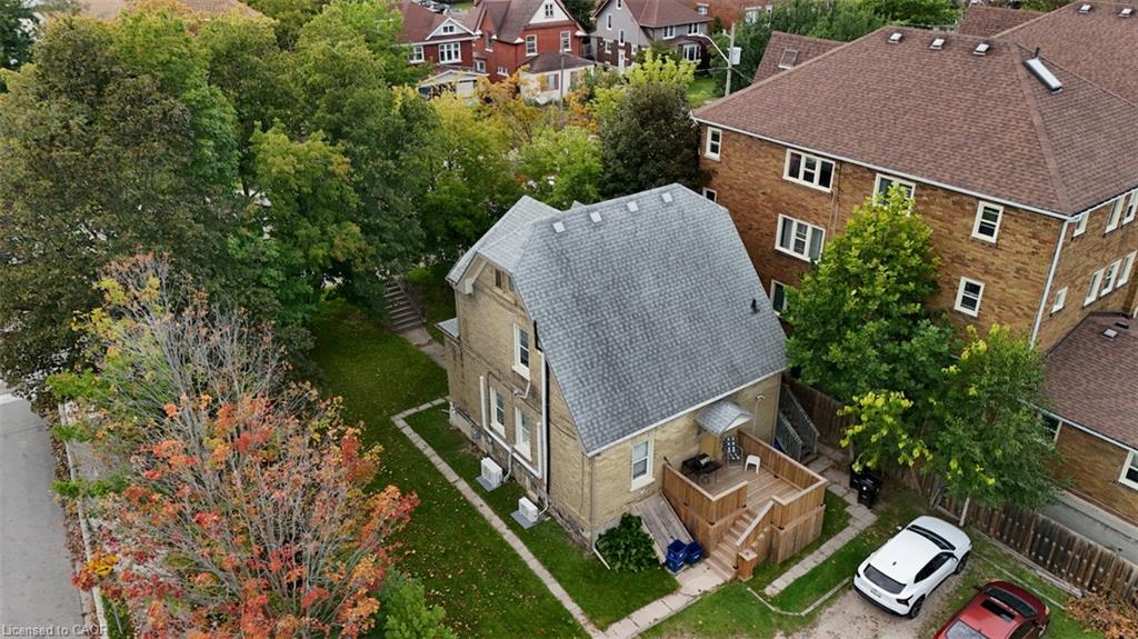 Brick and siding exterior with a front porch, a bay window, and a gabled roof