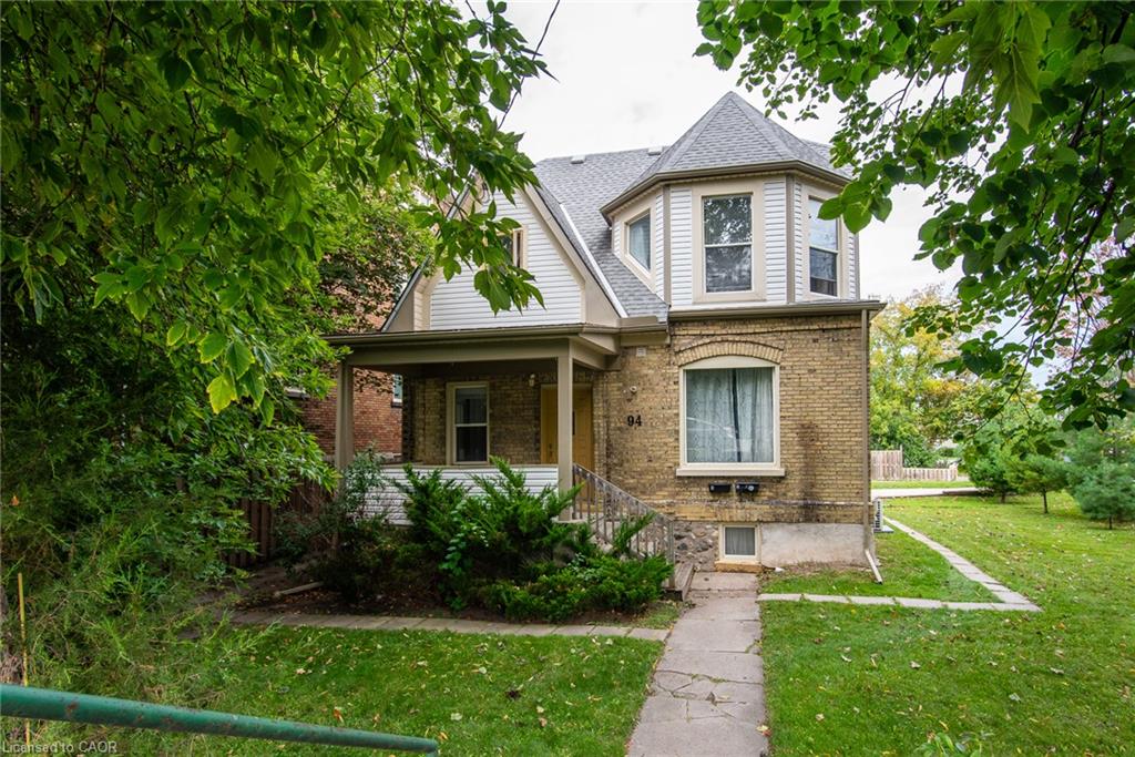 Brick exterior featuring multiple window styles
