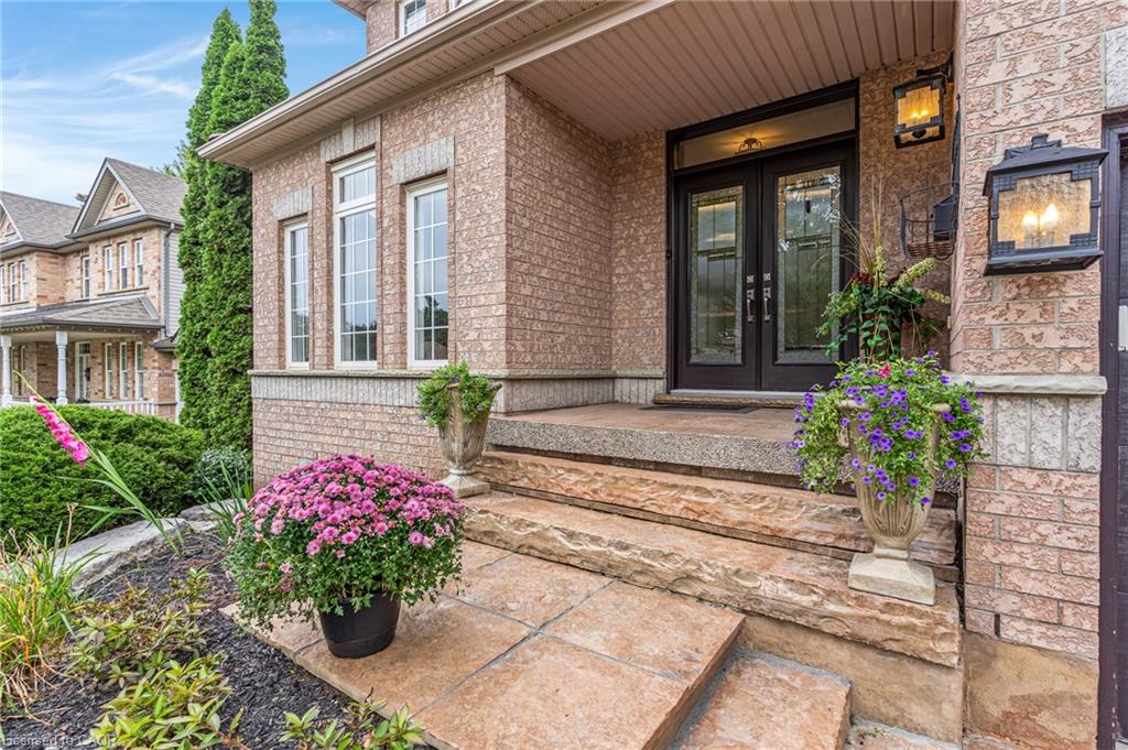 Brick exterior with stone accents and decorative wall sconces