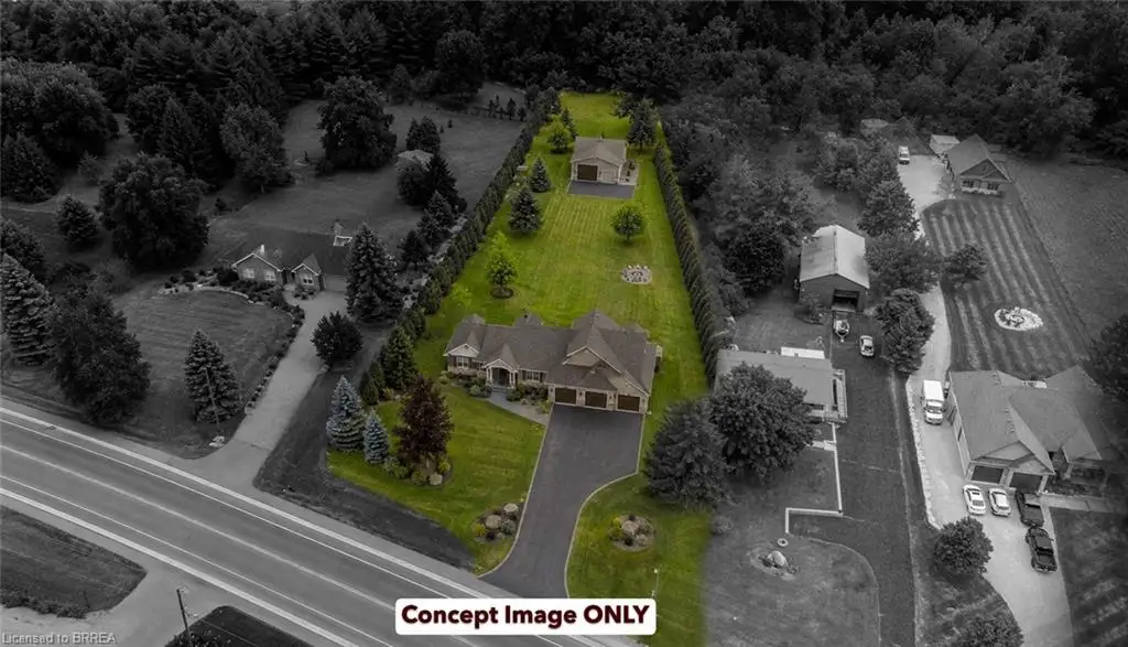 Spacious property featuring a prominent main residence with an attached three-car garage, a detached secondary garage, and a paved driveway