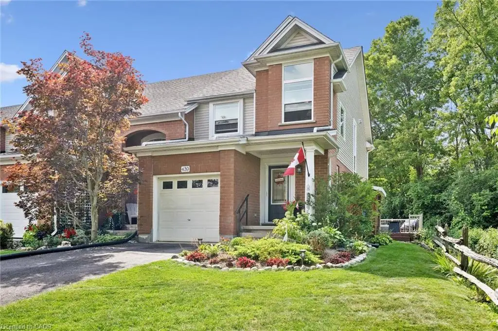 Brick and siding exterior with a single-car garage and a paved driveway
