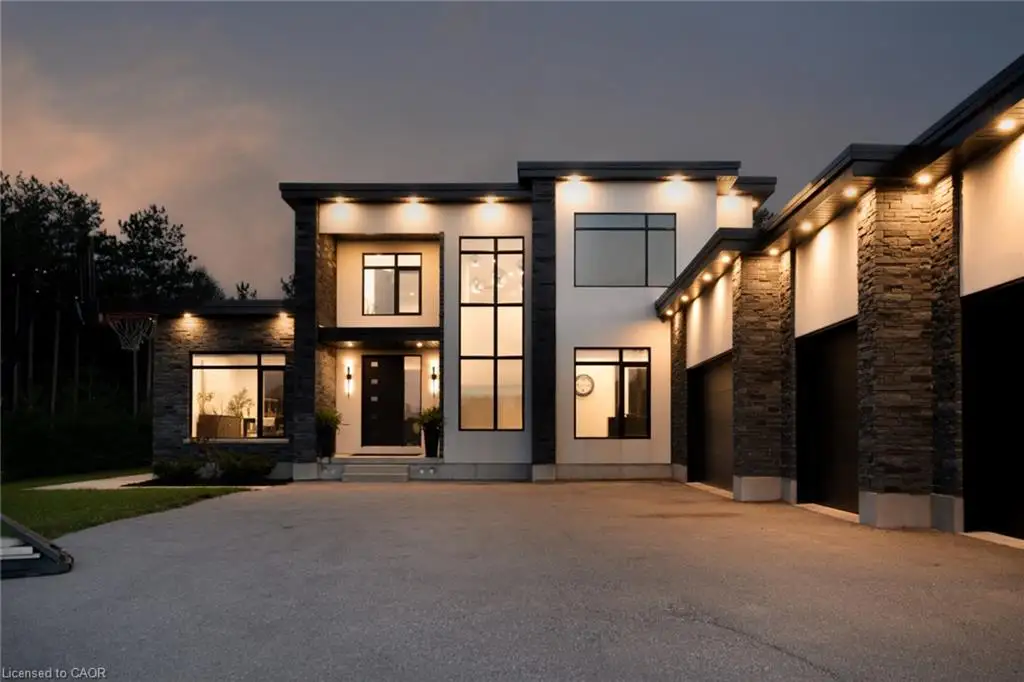 Modern architectural exterior featuring stone and stucco finishes