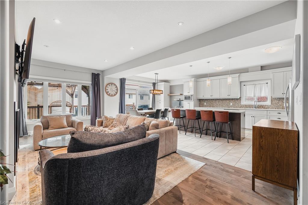 Living room featuring light wood-style floors and recessed lighting