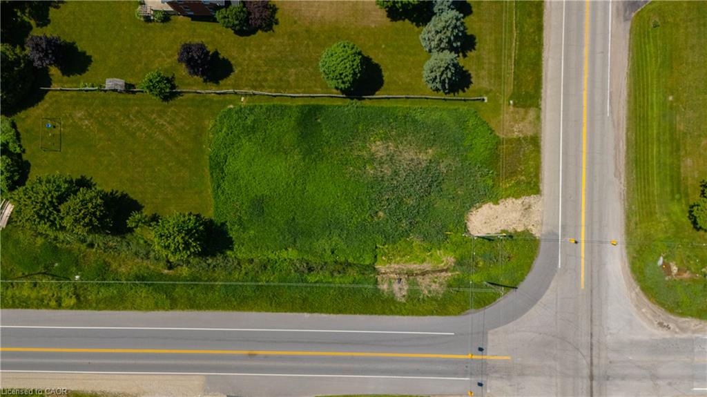 Expansive undeveloped land parcel at a road intersection