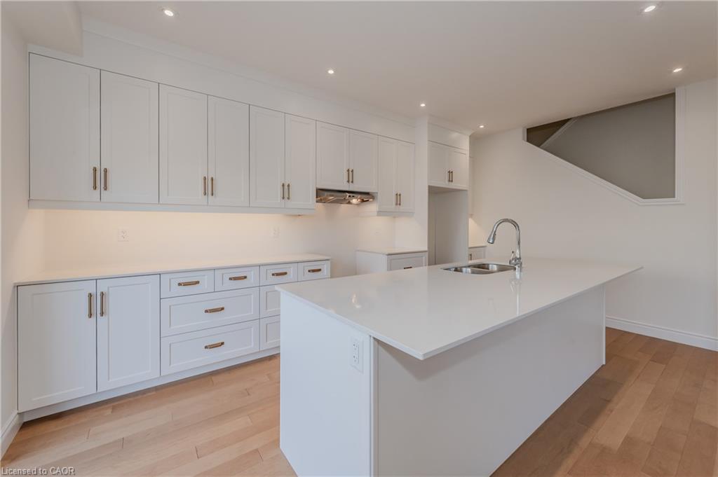 TO BE BULT Large island with breakfast bar with quartz countertops.  Appliances are included
