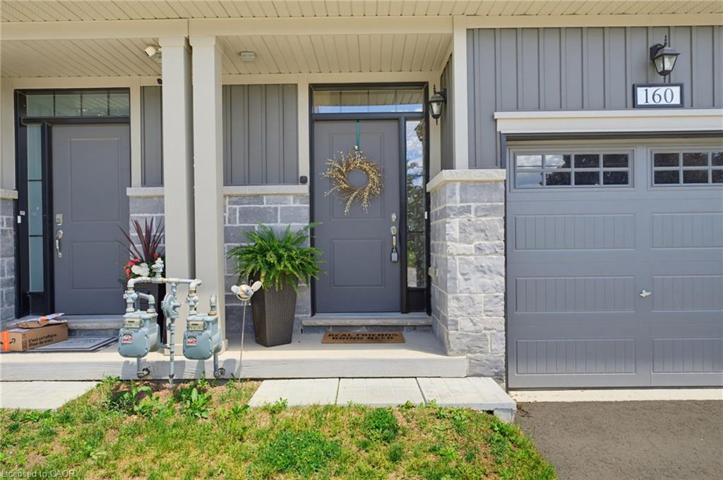160 Middleton Street, Thamesford, Contemporary Exterior Featuring Stone Accents and Board and Batten Siding