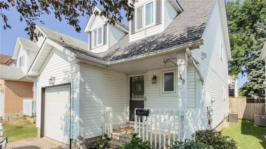 White siding exterior with a single-car garage