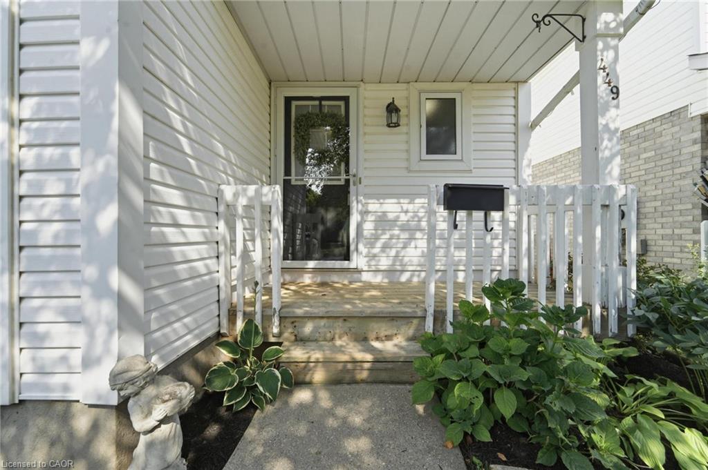 Front porch entrance with white siding