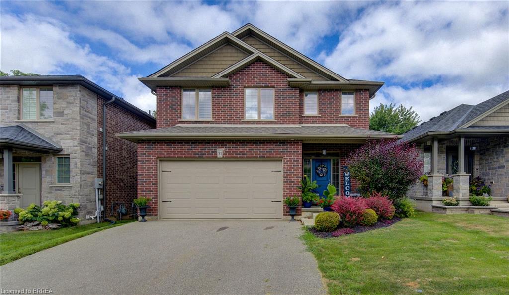 Brick and siding exterior with a pitched roof and a two-car garage