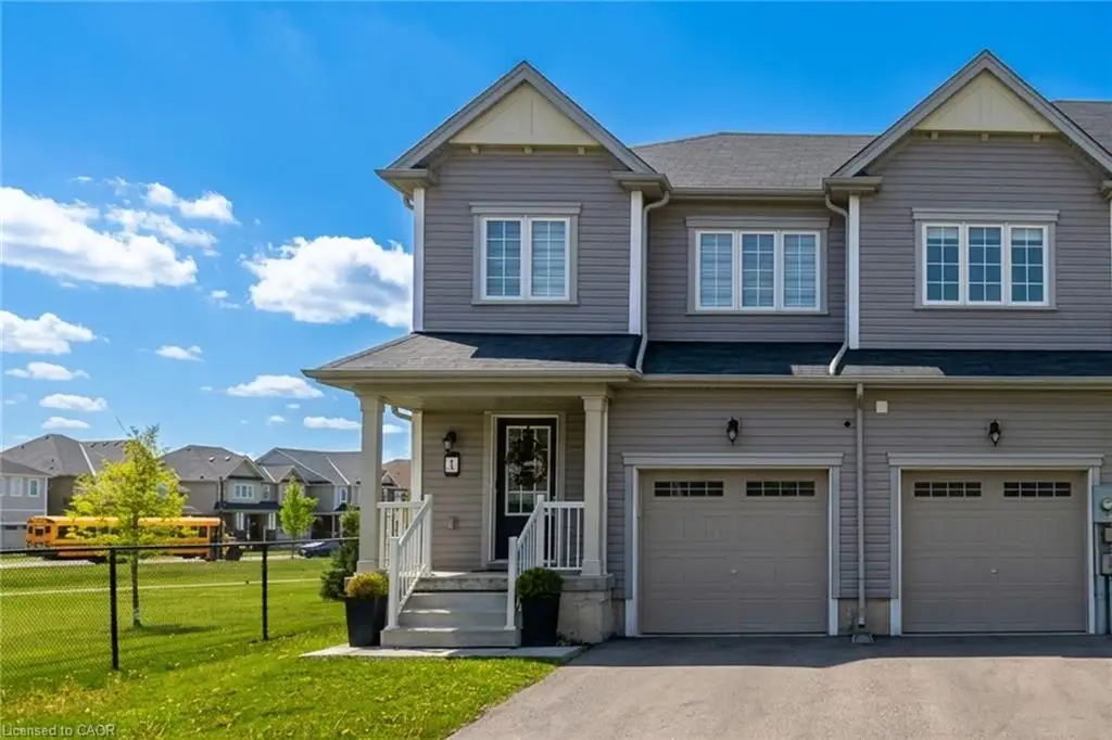Two-story exterior with horizontal siding, covered front porch, asphalt shingle roof, and dual attached garages