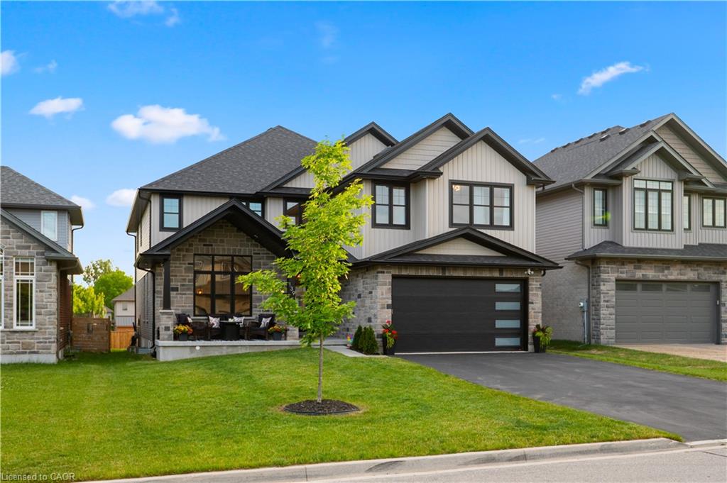 Contemporary two-story residence with stone and siding exterior