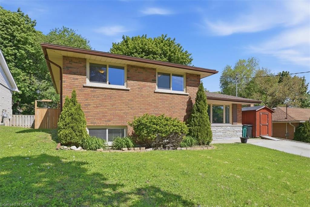 Brick exterior with stone accents and a sloped roofline