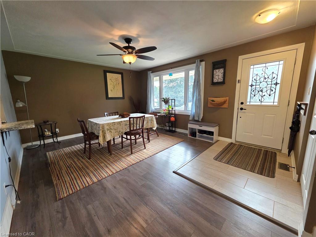 Wood-finish flooring throughout, complemented by a decorative entry door with leaded glass