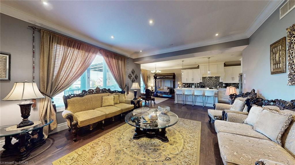 Open-concept living area featuring wood-finish flooring and recessed lighting