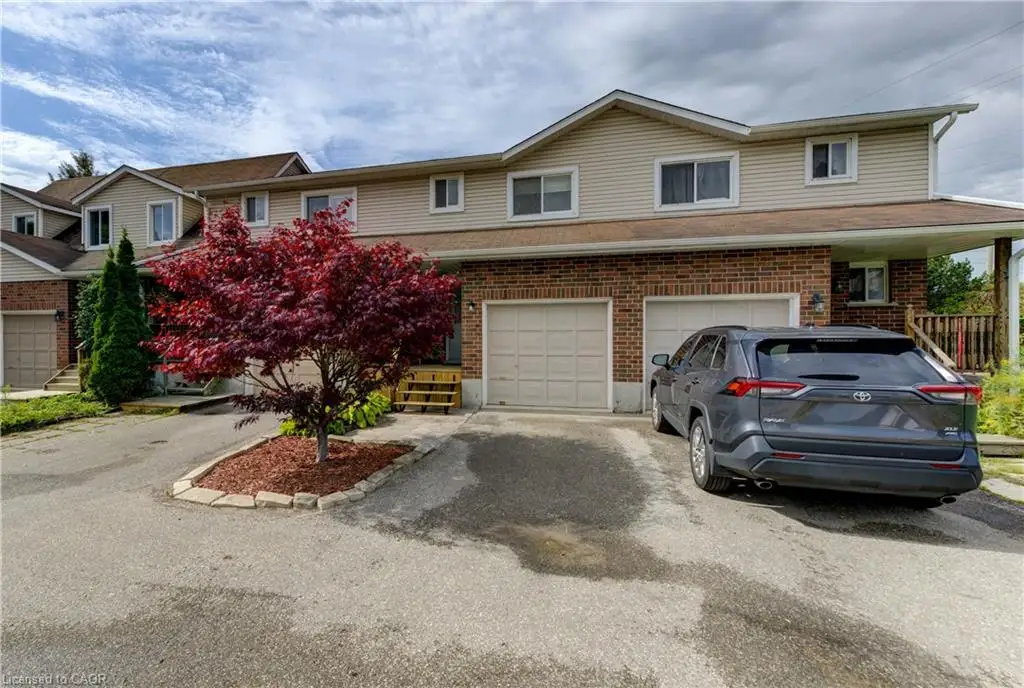 Brick and siding exterior with dual garage doors
