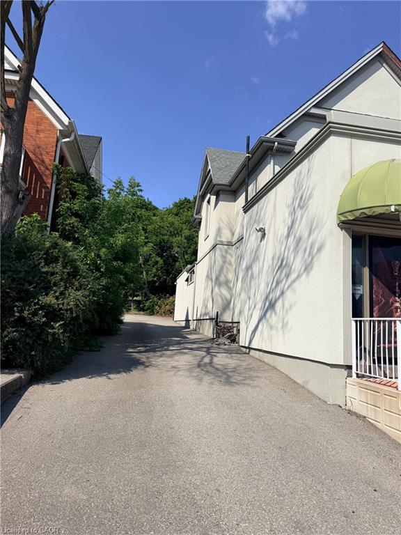 Paved driveway entry with stucco exterior