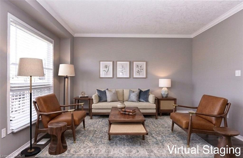 Spacious living area featuring ample natural light, crown molding, neutral wall tones, and recessed lighting