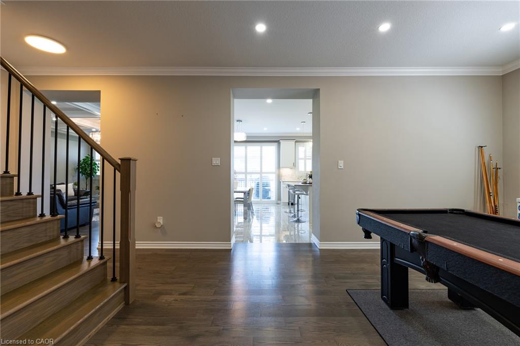 Wood-finish flooring throughout, with recessed lighting and crown molding