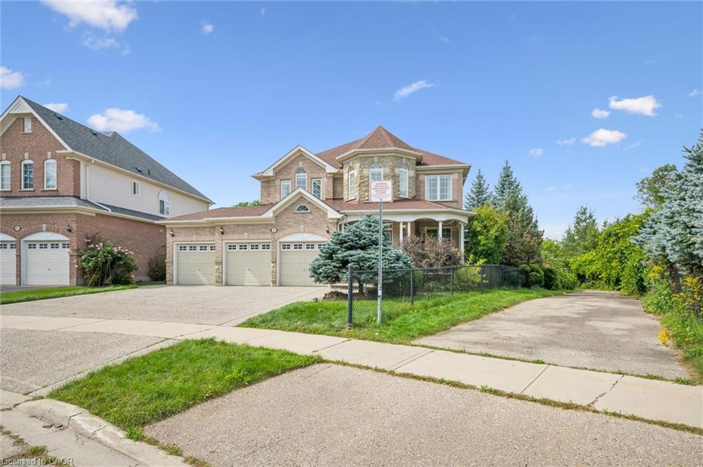 Brick and stone exterior with a multi-car garage
