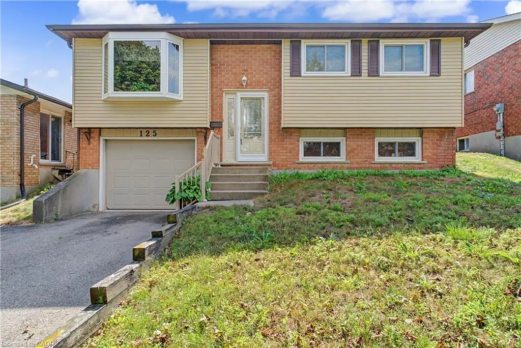 Brick and siding exterior with a single-car garage, bay window, and concrete front steps