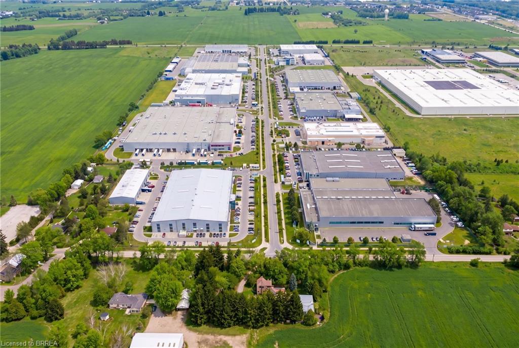 Expansive industrial park featuring multiple large-scale buildings with ample parking and direct road access - Rendering
