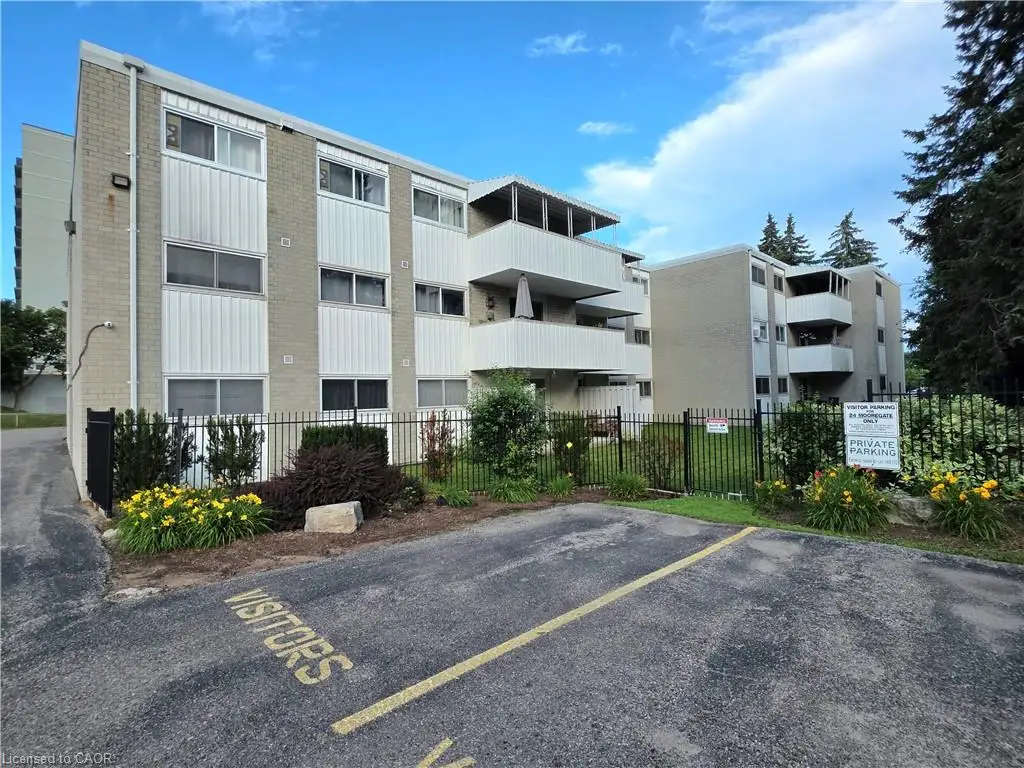 Multi-story residential building featuring brick and panel facade