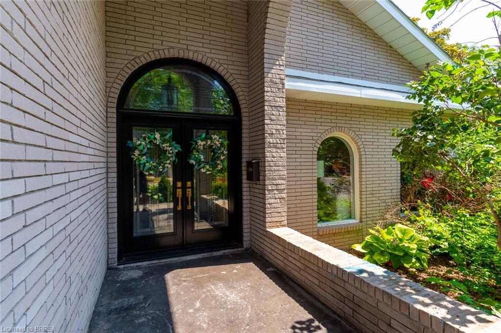 Arched black double entry doors with transom window