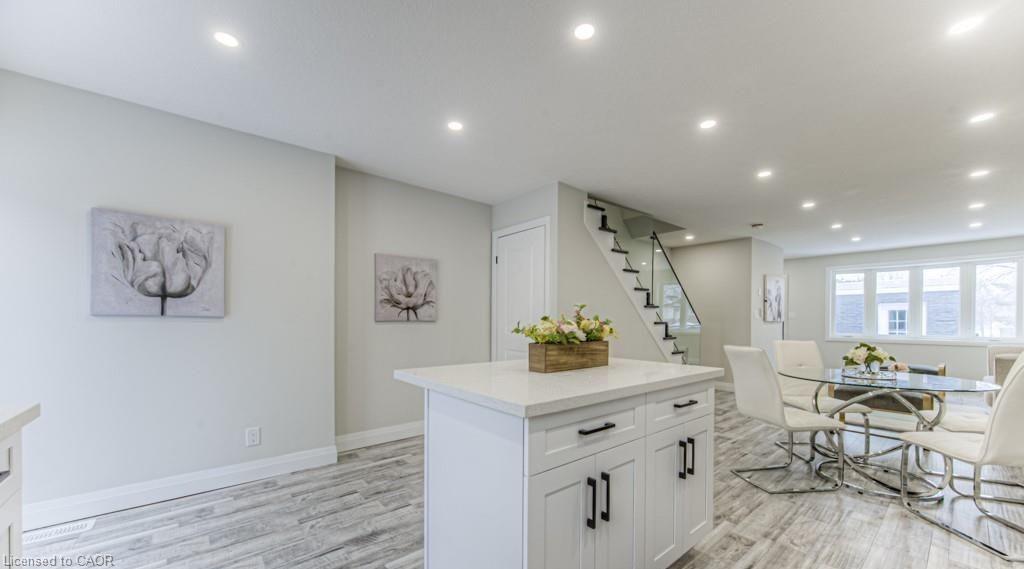 Kitchen island with solid surface countertop and cabinet storage
