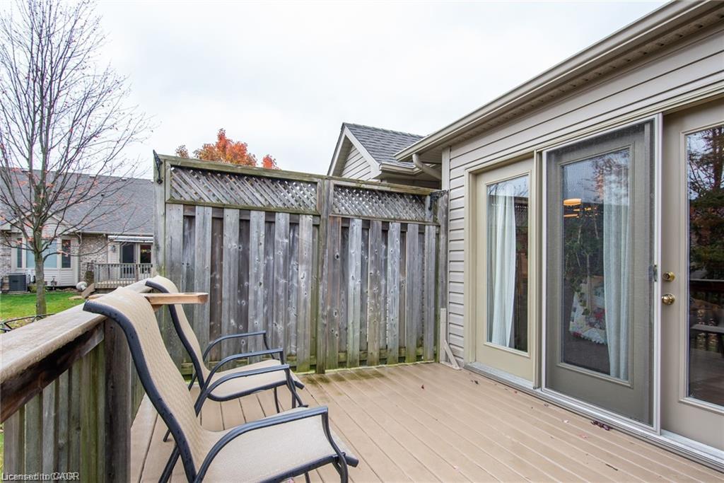 Exterior wood-finish deck with privacy fencing