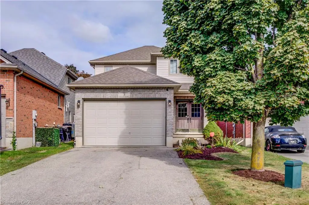 Two-story residence featuring a brick and siding exterior, an attached garage, and a concrete driveway
