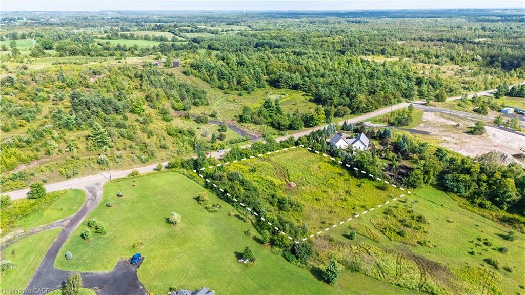 Expansive land parcel featuring diverse topography and natural vegetation