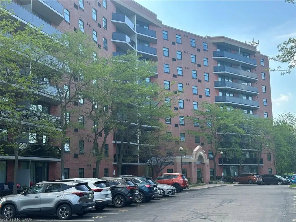 Brick exterior high-rise building featuring multiple levels of private balconies with dark railings