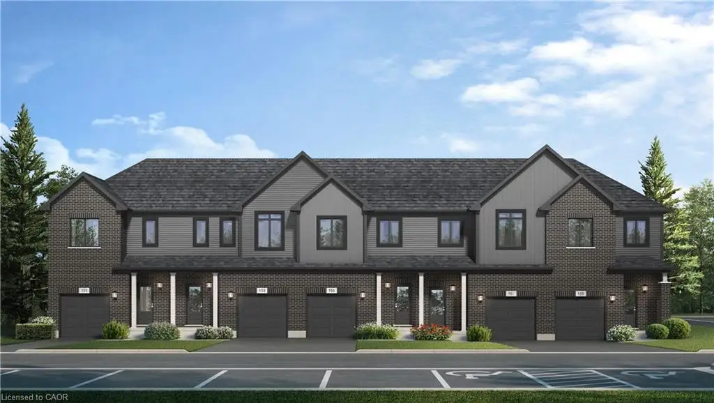 Multi-unit residential exterior featuring dark brick masonry, vertical siding accents, gabled rooflines, and individual attached garages