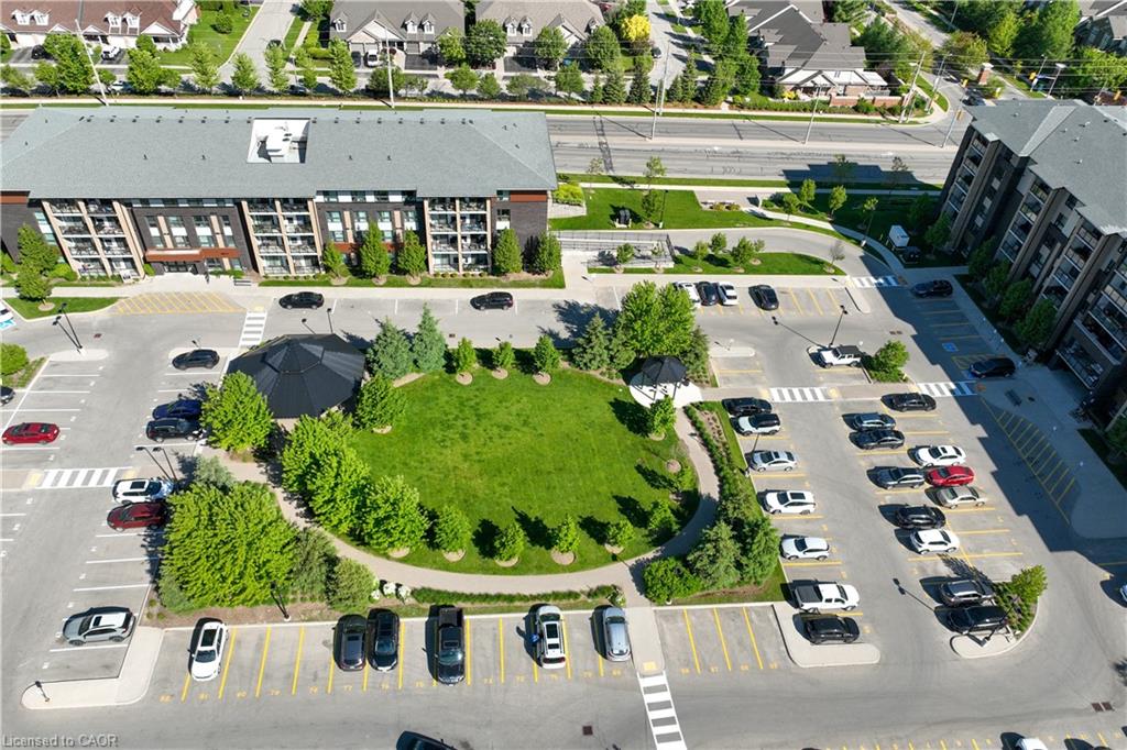 Modern multi-story building featuring dark exterior cladding and grey gabled roofing