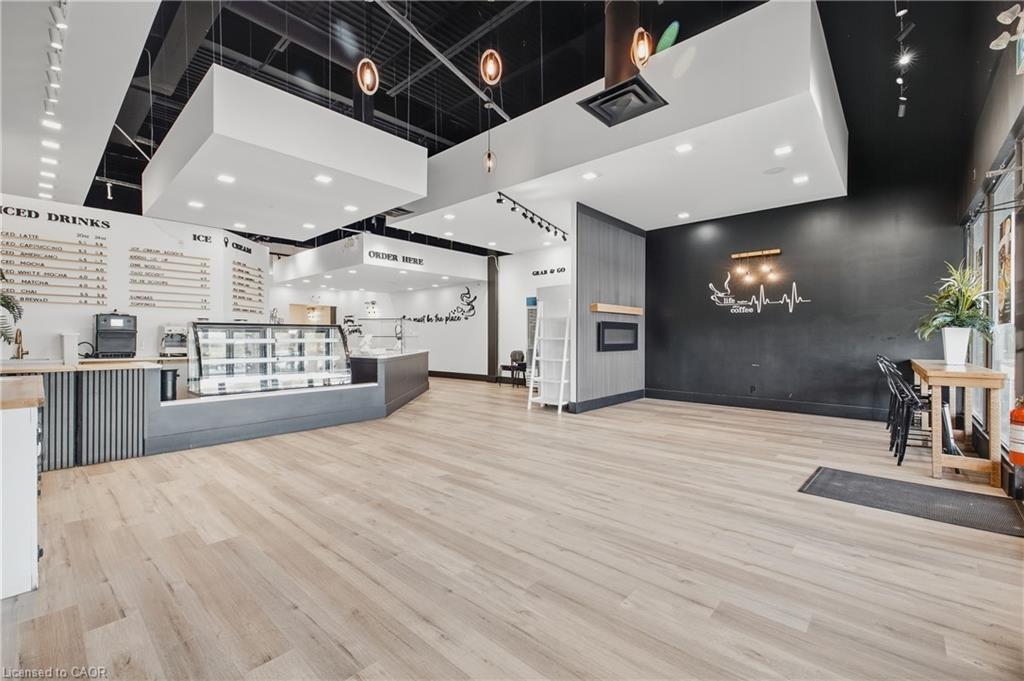 Light wood-finish flooring with a dark accent wall