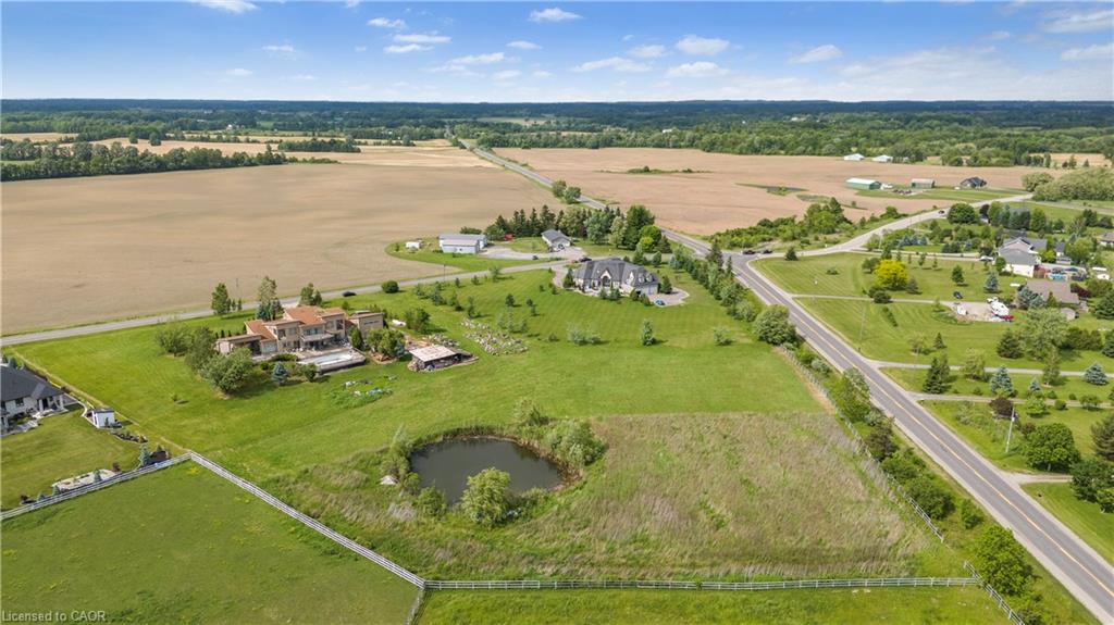 Aerial view of property and surrounding area featuring rural landscape