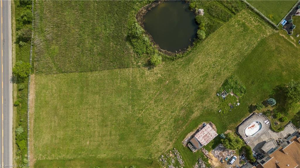 Aerial view of property's location featuring a nearby body of water