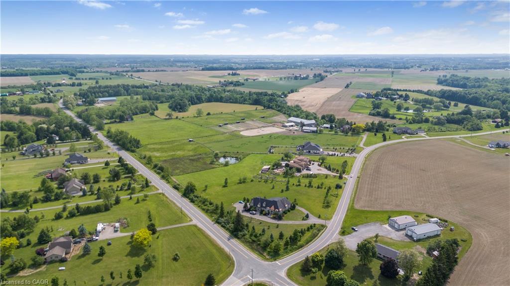 Aerial view of property and surrounding area with rural landscape and farmland