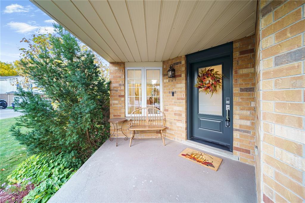 Brick exterior with covered concrete porch